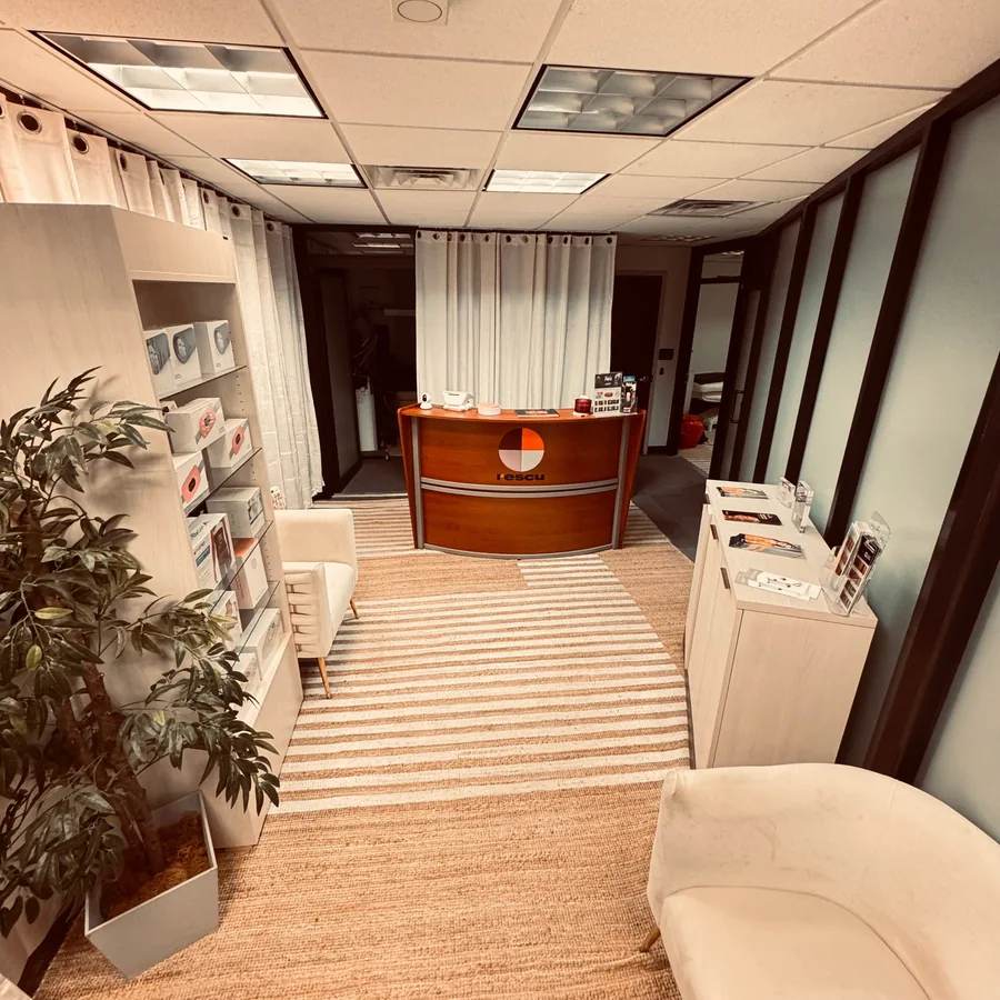 Rescu reception area with white chairs and a coral-colored desk